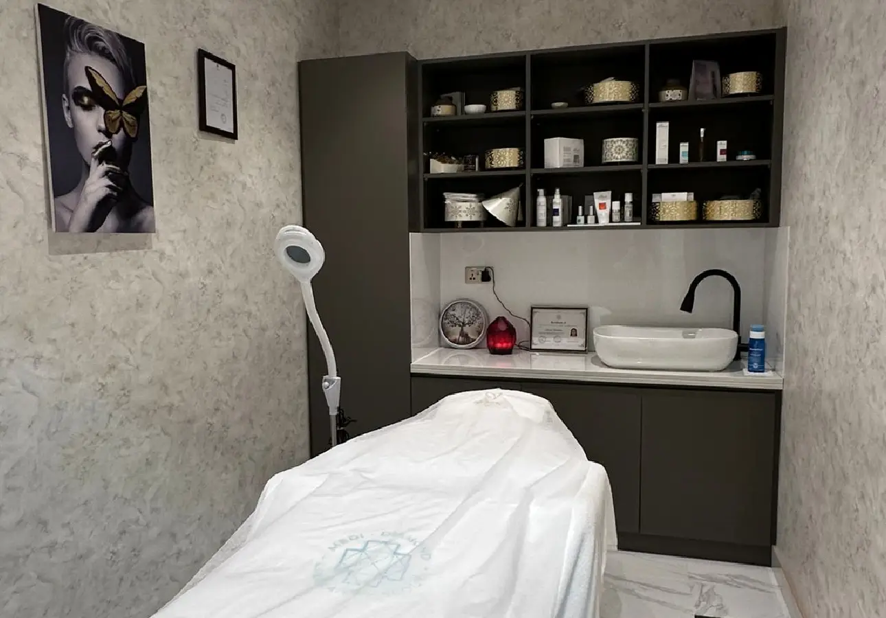 Luxurious facial treatment with natural skincare products and peaceful spa ambiance at Monarch Beauty Salon Dubai